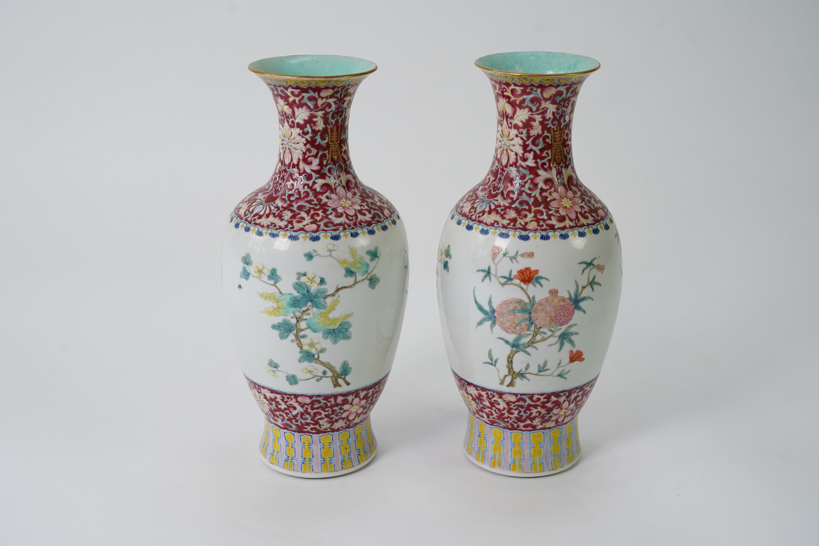 A pair of Chinese famille rose ‘sanduo’ vases, Qianlong seal mark, 19th century